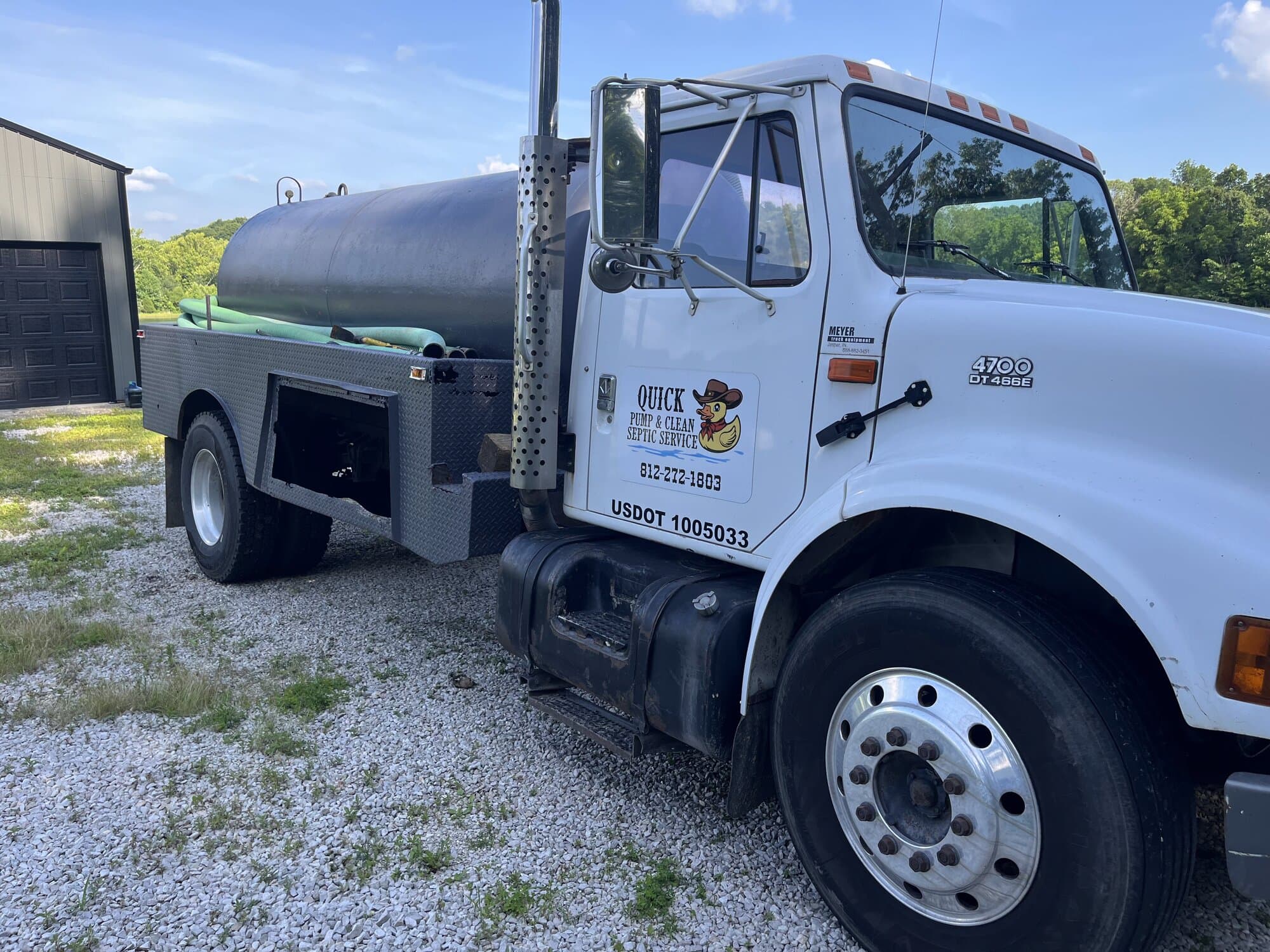 Quick Pump and Clean pump truck with cowboy duck logo — Call the Truck with the Duck